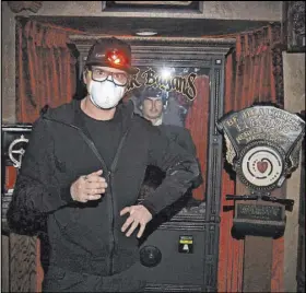  ?? Travel Channel ?? Zak Bagans wears a mask during the production of the miniseries “Ghost Adventures: Quarantine” at his Haunted Museum.