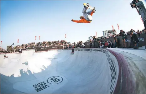  ??  ?? An athlete creates a stunt with his skateboard at this year’s Vans Park Series Pro Tour finals, held in Suzhou, East China’s Jiangsu province, on Oct 27.