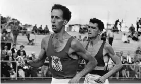  ?? Photograph: Bettmann/Bettmann Archive ?? John Landy, with Ron Clarke behind, when Landy broke the four-minute mile at Melbourne's Olympic Park.