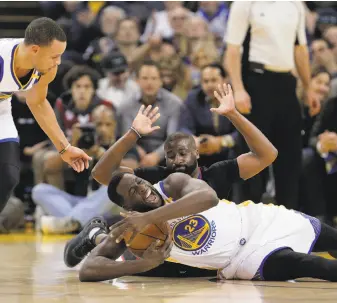  ?? Carlos Avila Gonzalez / The Chronicle ?? Warriors forward Draymond Green grabs the ball in front of the Clippers’ Raymond Felton during a home game in February. Green has become one of the NBA’s best defensive players.