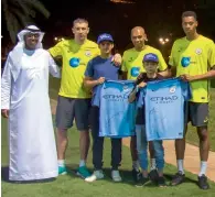  ?? Supplied photo ?? 17-year-old Hamad Khalil Alhousani and 15-year-old Syrian Bashar Fouad Alkaisi meet their football stars. —