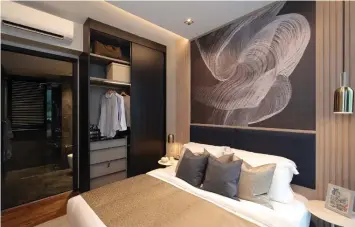  ??  ?? Master bedroom with built-in wardrobe that comes with a safe and accessorie­s tray