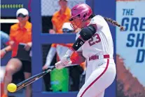  ?? NATE BILLINGS/THE ASSOCIATED PRESS ?? Oklahoma’s Tiare Jennings hits a single against Tennessee during Saturday’s Women’s College World Series game in Oklahoma City. The Sooners scored nine runs in five innings.