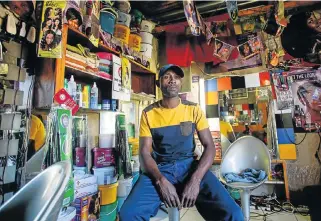  ?? /Simphiwe Nkwali ?? Low-value retailing: James Mazibuko at his Jabulani Hair Salon in Alexandra in Johannesbu­rg. Informal businesses do not have the necessary means to expand.