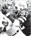  ??  ?? Buffalo Bills running back OJ Simpson, on his way to a record-setting 2,003 rushing yards, rolled up 250 yards against the New England Patriots, 45 years ago Sunday.