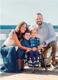  ??  ?? Miles McIntosh with his parents Nikki and Tony, and brother, Mason.