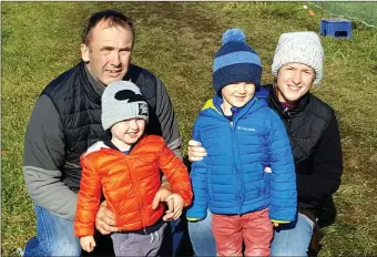  ??  ?? Derek and Kate McCarthy enjoying the coursing at Ballyheigu­e on Sunday with their son’s T.J and Tom.Photo Moss Joe Browne.