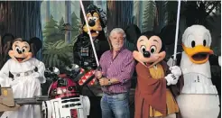  ?? Supplied ?? It was a sign of things to come in August 2010 when George Lucas posed with a group of Disney characters in Star Wars garb at Disney’s Hollywood Studios theme park in Florida.