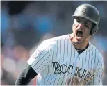  ?? DAVID ZALUBOWSKI THE ASSOCIATED PRESS ?? Colorado Rockies third baseman Nolan Arenado hit a two-run homer in the first inning Sunday to start a 12-0rout of the Nationals.