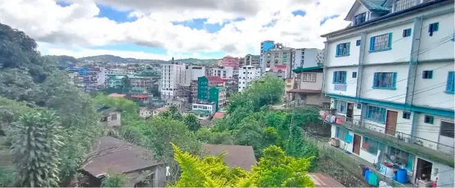  ?? PHOTOGRAPH COURTESY OF ALDWIN QUITASOL ALFONSO FOR THE DAILY TRIBUNE ?? BAGUIO’S tree-lined environmen­t is threatened by another wave of cutting of pine trees to give way to a constructi­on project by an influentia­l developer.