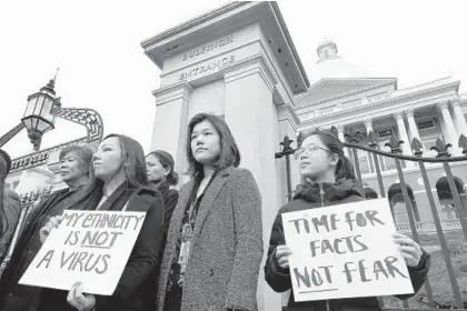  ?? STEVEN SENNE/AP ?? Asian Americans have become the target of xenophobic slurs because the coronaviru­s pandemic originated in China.