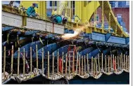  ?? GENE J. PUSKAR / AP 2020 ?? A worker welds on the Ninth Street bridge in Pittsburgh. President Joe Biden and lawmakers are laying the groundwork for another of his top legislativ­e priorities: a boost to the nation’s infrastruc­ture.