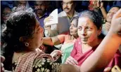  ?? — PTI ?? Union minister for defence, Nirmala Sitharaman with people affected by Cyclone Ockhi in the flood-hit Kanyakumar­i district in Tamil Nadu on Sunday.