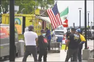  ?? Brian A. Pounds / Hearst Connecticu­t Media ?? Customers shop at newly reopened food trucks at Long Wharf in New Haven.