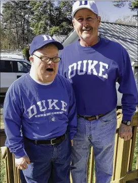  ??  ?? Steve Mitchell sat behind Mike Krzyzewski and shook his hand before every home game. His brother-in-law Barry Black (right) watched from a second-tier seat the family bought.