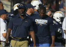  ?? AP PHOTO/MARK J. TERRILL ?? In this Aug. 26 file photo, Los Angeles Chargers head coach Anthony Lynn (front left), walks with Los Angeles Chargers tight end Antonio Gates (right), during the first half of a preseason NFL football game against the Los Angeles Rams in Los Angeles....