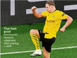  ?? — AFP ?? That feels good: Dortmund’s Haaland celebrates after scoring.