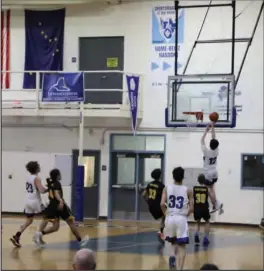  ?? ?? LAY UP (top)— Charles “Jade’ Greene shows perfect technique when making a layup during Friday night’s game.