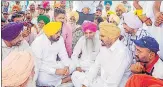  ?? PTI ?? CM Bhagwant Mann offers condolence­s to slain singer Sidhu Moosewala’s father Balkaur Singh, at Musa village in Mansa.