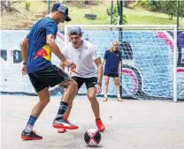  ?? PHOTO: GETTY IMAGES ?? Offtrack rivalry . . . Daniel Ricciardo, of Australia, looks for a way past his Red Bull Racing teammate, Max Verstappen, of the Netherland­s, during a futsal match yesterday ahead of Monday’s Formula One Grand Prix of Brazil at Autodromo Jose Carlos Pace in Sao Paulo.