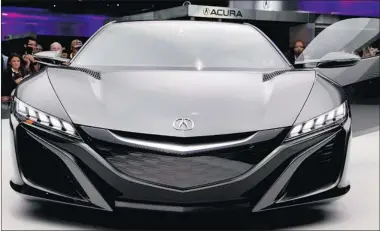  ?? PAUL SANCYA/ THE ASSOCIATED PRESS ?? Acura showed an updated version of its NSX supercar concept. The low and wide concept goes on sale in about two years.