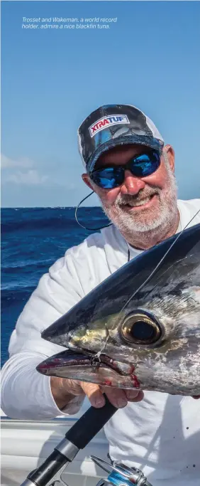  ??  ?? Trosset and Wakeman, a world record holder, admire a nice blackfin tuna.