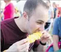  ?? Windsor Star files ?? Ryan Schiel drove from Westland, Mich., to sink his teeth into corn on the cob at last year’s Tecumseh Corn Festival.