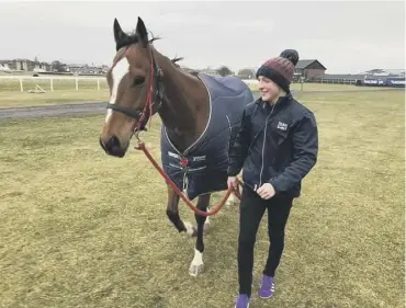  ??  ?? 0 Timo Condie with one of his charges at Michael Scudamore’s racing stables