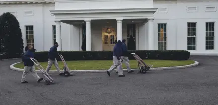  ?? GERALD HERBERT/AP FILE ?? Workers already are hauling records out of the West Wing of the White House. When the Trumps depart Wednesday, removing their belongings and installing the Bidens’ will kick into high gear.