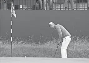  ?? KYLE TERADA/USA TODAY SPORTS ?? Adrian Meronk putts on the third green during The Open Championsh­ip golf tournament July 20 at Royal Liverpool.