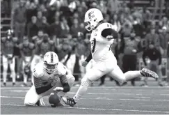  ?? PHOTO BY BEN DODDS/UTC ATHLETICS ?? UTC’s Victor Ulmo kicks the game-winning field goal against Samford last Saturday in Birmingham, Ala.