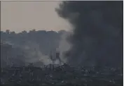  ?? LEO CORREA — THE ASSOCIATED PRESS ?? Smoke rises following an explosion in the Gaza Strip, as seen from southern Israel, on Tuesday.