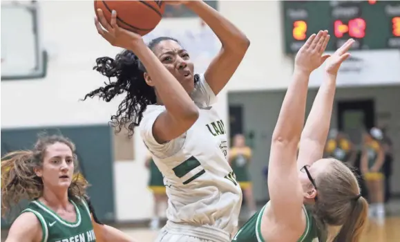  ?? GEORGE ROBINSON / THE LEAF-CHRONICLE ?? Northwest's Ta'mia Scott goes up for two of her game-high 24 points in the first quarter against Green Hill in their Region 5-AAA girls tournament quarterfinal game Saturday, Feb. 27, 2021 at Northwest High.