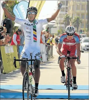  ?? Picture: MIKE HOLMES ?? RACE WINNER: A triumphant Nolan Hoffman, 29, of Johannesbu­rg, crosses the finish line