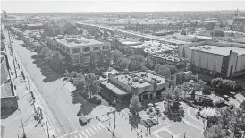  ?? MORRIS, THE OKLAHOMAN] [PHOTO BY DAVE ?? Sonic Headquarte­rs and Lower Bricktown are shown along Reno Avenue.