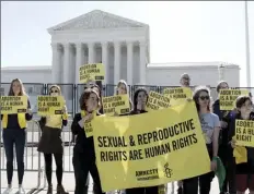  ?? AP photo ?? Abortion rights activists protest outside of the U.S. Supreme Court on Wednesday in Washington. A draft opinion suggests the U.S. Supreme Court could be poised to overturn the landmark 1973 Roe v. Wade case that legalized abortion nationwide, according to a Politico report.