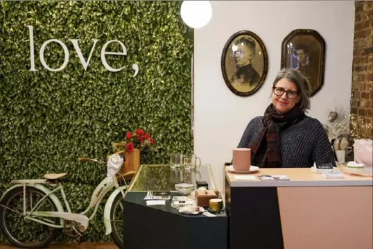  ?? Tim Robbibaro/For the Post-Gazette ?? Co-owner Kelly Sanders operates the store love, on Market Street in Downtown.