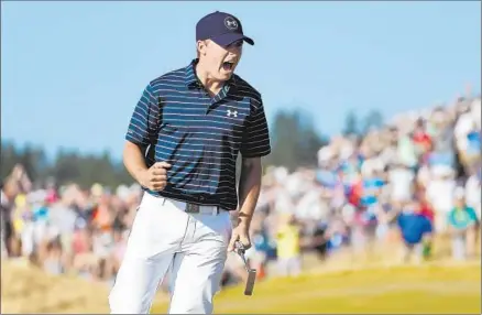  ?? Ross Kinnaird Getty I mages ?? A BIRDIE at No. 16 gave Jordan Spieth a three- shot lead, and he celebrated as though the tournament was all but over. It wasn’t. He double- bogeyed 17, birdied 18 and then watched Dustin Johnson miss putts on the f inal hole that could have won it or...