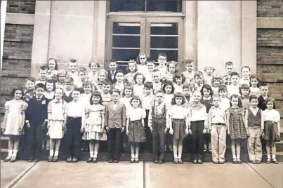  ?? Courtesy of Barbara Maher ?? First-grade students who began school at Sacred Heart Elementary School in Shadyside in 1952 pose for a class photo. A group of classmates from this and another first-grade classroom today will celebrate their turning 70.