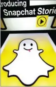  ?? BONAVENTUR­E/AFP LIONEL ?? This photo taken in January 2014 shows the logo and a page of mobile app Snapchat.