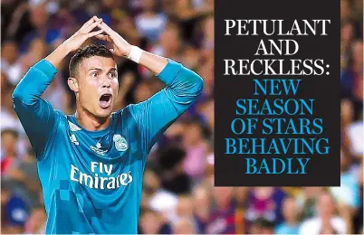  ?? MANU FERNANDEZ / AP ?? Real Madrid’s Cristiano Ronaldo reacts to being booked during Sunday’s 3-1 Spanish Super Cup first-leg victory over Barcelona at Camp Nou stadium in Barcelona. Ronaldo was suspended for five games on Monday after shoving the referee when he received a...