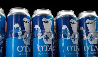  ?? ?? Beer cans with writing OTAN inspired by the North Atlantic Treaty Organizati­on (NATO) logo by Olaf Brewing, in Savonlinna, eastern Finland, Tuesday, May 17, 2022