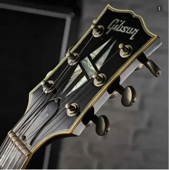  ??  ?? 1
1. The Les Paul Customstyl­e Florentine includes Gibson’s top-of-therange hallmark of five-piece split diamond pearl headstock inlays