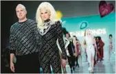  ?? MARY ALTAFFER/AP ?? The Blonds designers David Blond, left, and Phillipe Blond stand on the runway Feb. 15 after presenting their collection at New York Fashion Week.