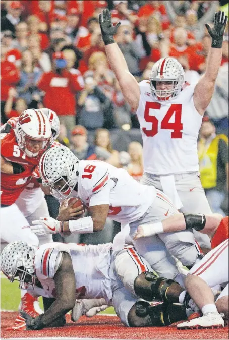  ?? [JOSHUA A. BICKEL/DISPATCH] ROBERTSON/DISPATCH] ?? Billy Price signals touchdown after J.T. Barrett scores on a 1-yard run in the second quarter.