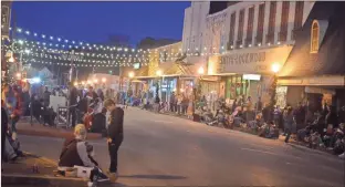  ??  ?? left: Parade goers waited on South Marble Street for the festivitie­s to start on Dec. 5 2019. below: Snow was brought in to make it a true holiday experience in downtown Rockmart for the 2019 Christmas Parade.