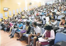 ?? RUDOLPH BROWN/PHOTOGRAPH­ER ?? Students attending a recent lecture in the Faculty of Medical Sciences at the University of the West Indies, Mona campus.
