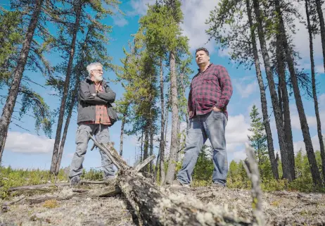  ?? — AFP photos ?? Grandpré (left) stands with Kanapé (right) in the Canadian boreal forest of the La Haute-Côte-Nord municipali­ty west of Baie-Comeau, Quebec.