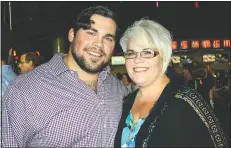  ?? NWA Democrat-Gazette/CARIN SCHOPPMEYE­R ?? Chris Severio and his mother, Dawn Tate, attend the Greater VIP screening Aug. 22. Severio played the role of Brandon Burlsworth in the biographic­al movie.