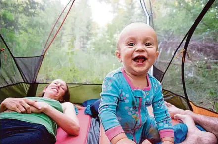  ?? Rob Roberts ?? Camping gear can be entertaini­ng for young children like Talon, shown in a tent in the Rattlesnak­e Wilderness, Mont.